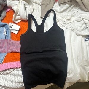 Black fitted tank top with scoop neck and backless design